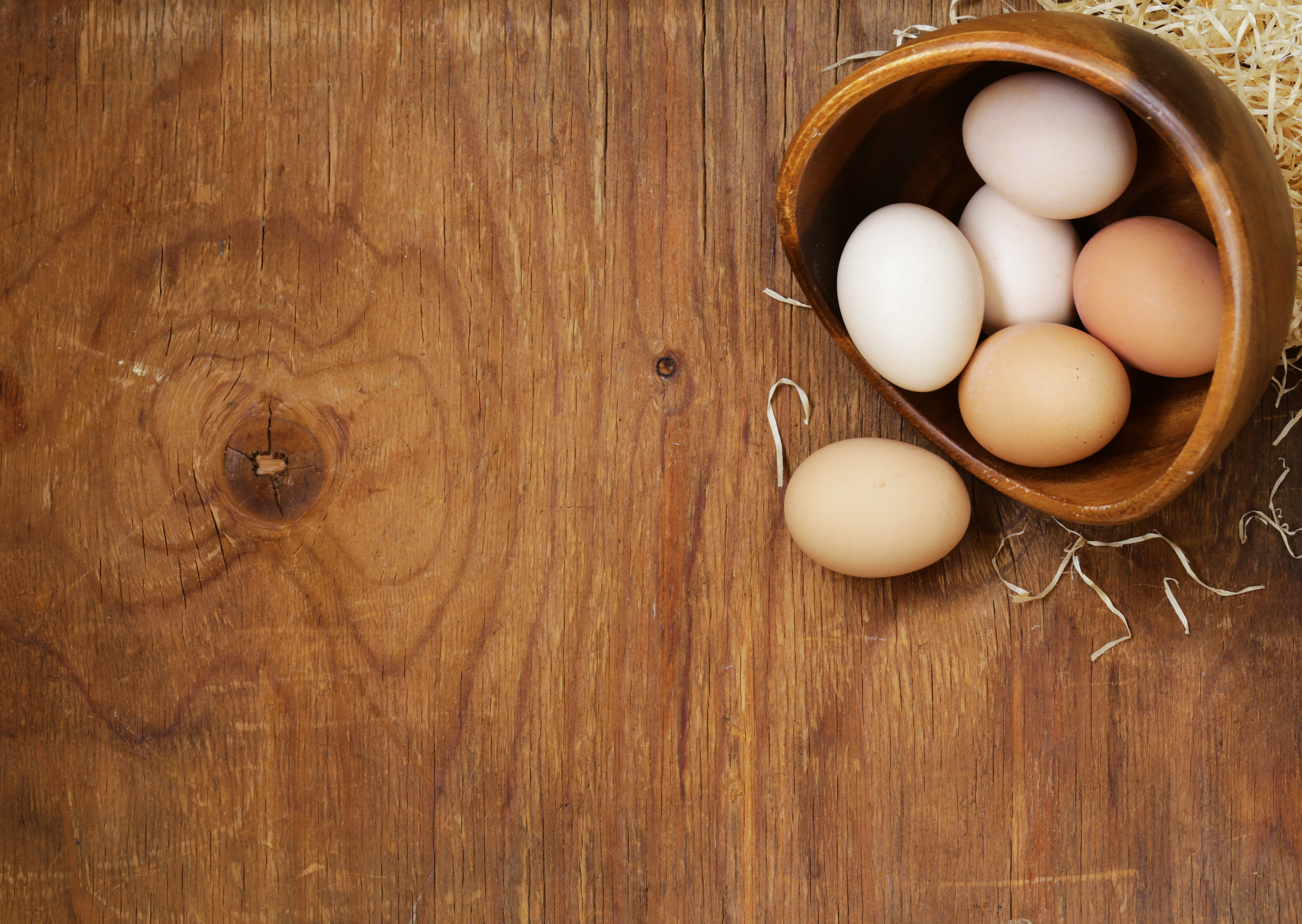 Farm natural organic eggs on a wooden background What's With Wheat