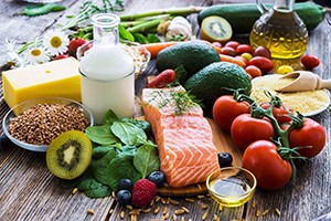 Selection of healthy food on rustic wooden background